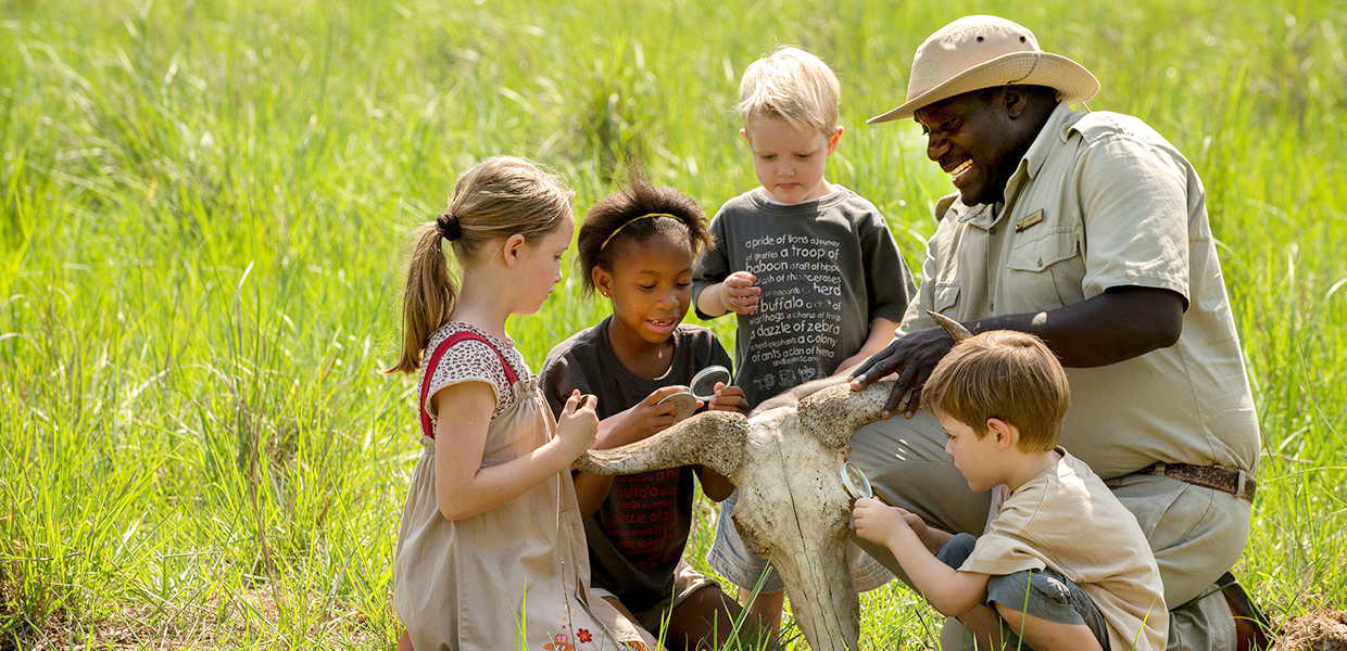 Kids With A Guide On A Tour. Credit: Uganda Family Tours And Travel